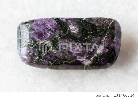 sample of tumbled kataranskite mineral on white 131466314