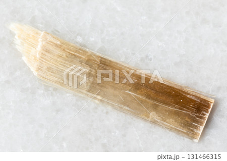 sample of raw nemalite mineral on white marble sample of raw nemalite mineral on white marble 131466315