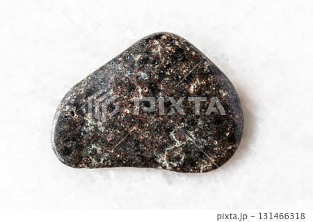 sample of basalt with hematite stone on white marble  131466318