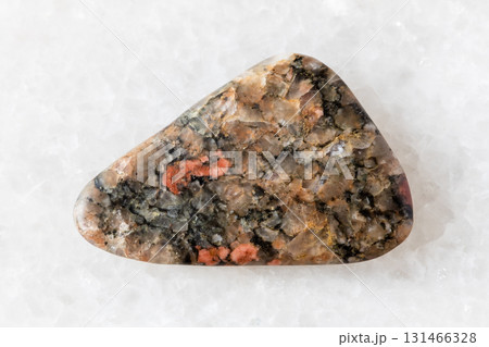 sample of polished gneissoid granite rock on white 131466328
