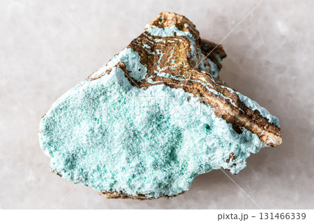 sample of raw aurichalcite mineral on white marble 131466339