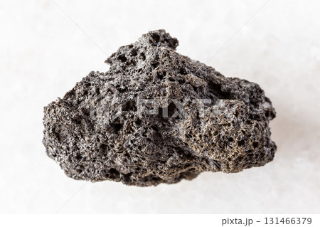 sample of raw pumice rock on white marble 131466379