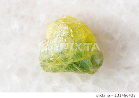 rough yellow green sapphire mineral on white rough yellow green sapphire mineral on white 131466435