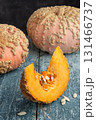 Galeux d Eysines Pumpkin Slice With Seeds On Rustic Table 131466737
