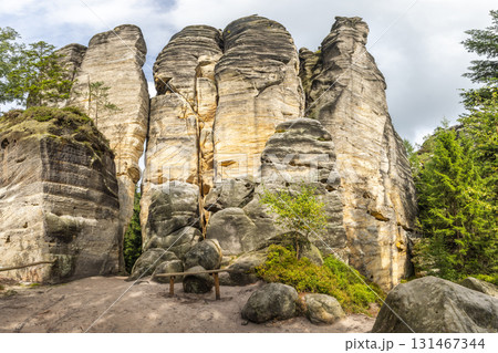 Adrspach-Teplice Rocks, sandstone formations in Hradec Kralove Region in Czech Republic, Europe. Scenic rock formations display nature's artwork, with layered details and textures adding character. Adrspach-Teplice Rocks, sandstone formations in Hradec Kralove Region in Czech Republic, Europe. Scenic rock formations display nature's artwork, with layered details and textures adding character. 131467344