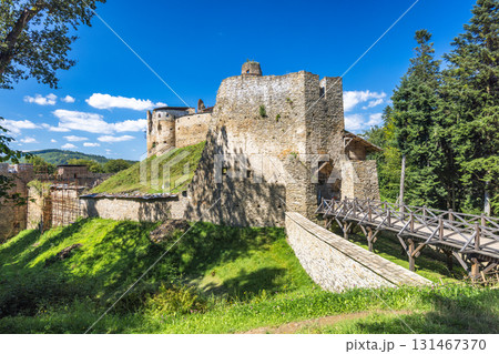 Zborov Castle near Bardejov town in North-Eastern Slovakia, Europe. Scenic view of a medieval stone castle on a hill under a blue sky, showcasing its historical architecture and scenic surroundings. 131467370