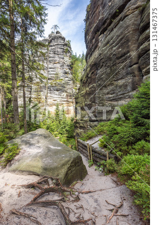 Landscape of Adrspach-Teplice Rocks area, in Hradec Kralove Region in the Czech Republic, Europe. Towering rock formations amidst lush forest, creating a captivating natural landscape. Landscape of Adrspach-Teplice Rocks area, in Hradec Kralove Region in the Czech Republic, Europe. Towering rock formations amidst lush forest, creating a captivating natural landscape. 131467375