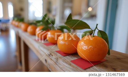 Lucky oranges with green leaves arranged for festive cultural celebration Lucky oranges with green leaves arranged for festive cultural celebration 131467569