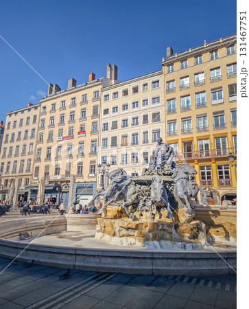 Lyon, France - February 13, 2024 The Fontaine Bartholdi, a monumental bronze sculpture at the Place des Terreaux in Lyon. The fountain depicts a female on a chariot with four great rivers of France Lyon, France - February 13, 2024 The Fontaine Bartholdi, a monumental bronze sculpture at the Place des Terreaux in Lyon. The fountain depicts a female on a chariot with four great rivers of France 131467751
