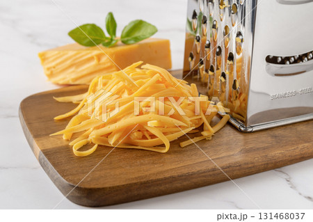 Heap of shredded cheddar cheese close-up. 131468037