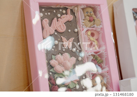 A gift box with handmade teddy bear-shaped chocolates and decorative elements. A gift box with handmade teddy bear-shaped chocolates and decorative elements. 131468180