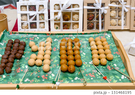Colorful candy balls on a wooden tray Colorful candy balls on a wooden tray 131468195