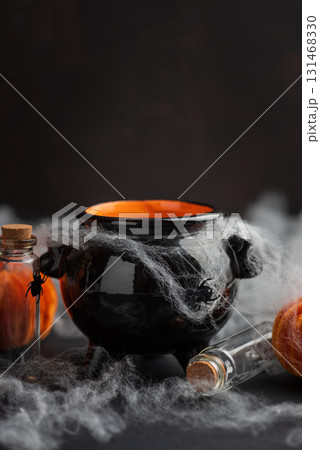 Halloween Cauldron with Pumpkins, Spiders and Cobwebs Halloween Cauldron with Pumpkins, Spiders and Cobwebs 131468330