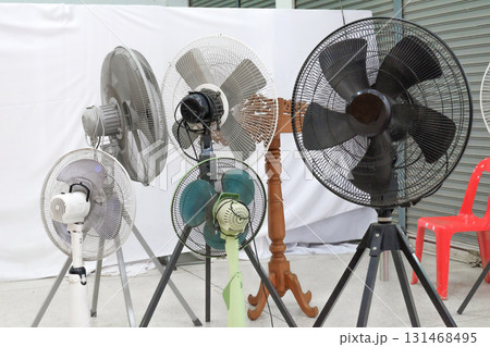Metal fan blowing cold air in storage shed. Metal fan blowing cold air in storage shed. 131468495
