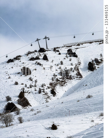 Gondola lift cabins at Amirsoy ski resort, Uzbekistan. Winter landscape 131469155