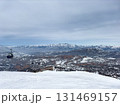 Ski slope and gondola lift cabins at Amirsoy ski resort, Uzbekistan. 131469157