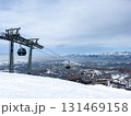 Gondola lift cabins at Amirsoy ski resort, Uzbekistan. Winter landscape 131469158