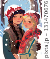 Two teenage girls outdoors in winter, hugging each other and looking at the camera. One brunette and one blonde, both wearing knitted hats. Snow is falling, they appear happy and in love. 131470676