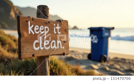 Wooden sign inviting to keep the beach clean at sunset 131470700