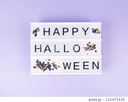 Happy halloween greetings on lightbox on purple background Happy halloween greetings on lightbox on purple background 131471416