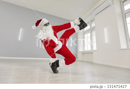 Santa Claus breakdancing wearing red suit and cute funny sunglasses, humorous and energetic dancer 131471427
