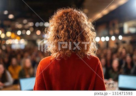 Student founder presents innovative ideas at a pitch event in a busy venue 131471593