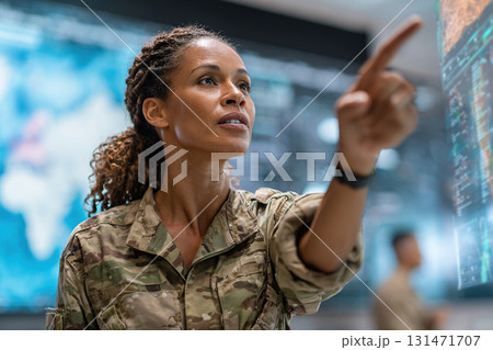 Logistics officer conducts briefing in command center during operations Logistics officer conducts briefing in command center during operations 131471707