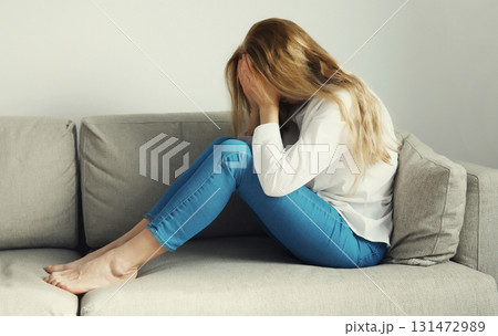 Upset sad crying woman while experiencing mental suffering, depression, fatigue, emotional stress 131472989