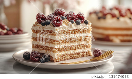 Layered honey cake slice with berries on white plate decorated with whipped cream fresh berries. Layered honey cake slice with berries on white plate decorated with whipped cream fresh berries. 131474058