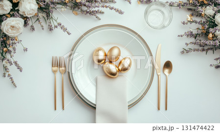 Luxury Happy Easter. Elegant top view, layout, minimalist style, Easter decorated table with golden eggs and lavender bouquet Luxury Happy Easter. Elegant top view, layout, minimalist style, Easter decorated table with golden eggs and lavender bouquet 131474422