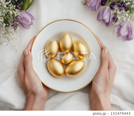 Happy Easter. Luxury white, pink, golden eggs and tulips bouquet arranged on napkin Easter table, matching cutlery and glassware 131474443