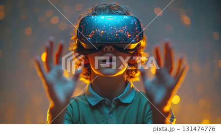 Boy wearing virtual reality headset with glowing digital projection, hand gestures control 131474776