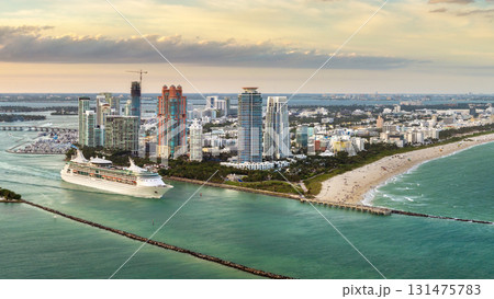 USA travel destination. Miami skyline with ocean cruise liner departing from port. Holiday vacation concept 131475783