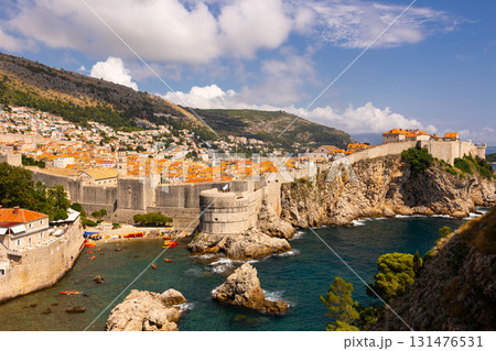 Vivid contrast of blue sky and red tiled roofs is hallmark of Dubrovnik Fortress. Vivid contrast of blue sky and red tiled roofs is hallmark of Dubrovnik Fortress. 131476531