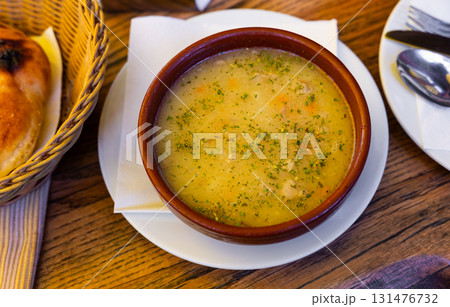 Serbian veal soup with vegetables and herbs 131476732