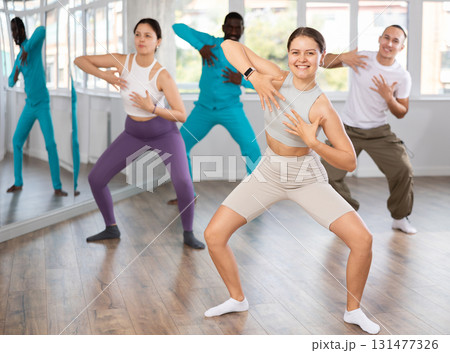 Young woman practicing active dance in training hall Young woman practicing active dance in training hall 131477326