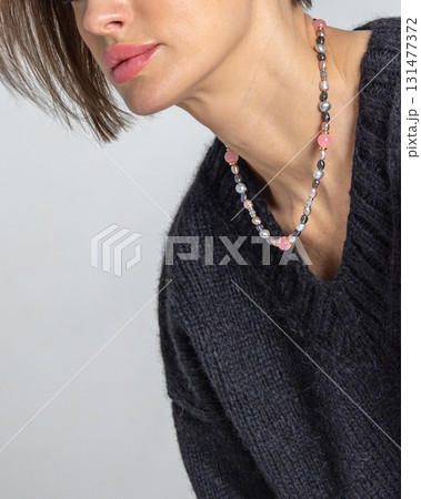 Neck of young woman close-up on grey background. Studio photography. Vertical photo. High quality photo 131477372