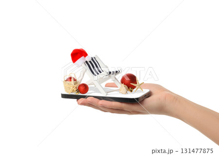 Hand holds a holiday-themed beach chair, isolated, PNG 131477875