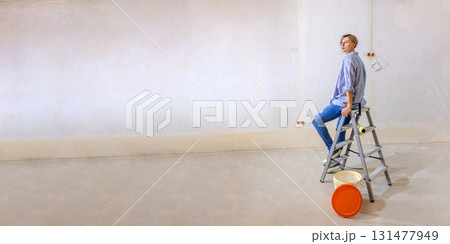 Woman in new apartment with dreams about new life. Renovation in new apartment. Repair work of home. High quality photo Woman in new apartment with dreams about new life. Renovation in new apartment. Repair work of home. High quality photo 131477949