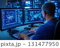 Cybersecurity engineer analyzing global threat map and code on multiple screens in a high-tech monitoring command center 131477950