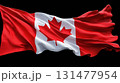 Close-up of the Canadian flag with red maple leaf on white background and vibrant redside panels in flowing fabric  131477954