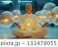 Futuristic monk in white meditating with floating glowing orbs, sci-fi spiritual scene of energy balance and inner power 131478055