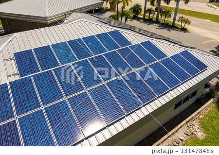 Solar photovoltaic panels mounted on house roof for producing clean ecological electric energy. Investing in renewable electricity for retirement income concept Solar photovoltaic panels mounted on house roof for producing clean ecological electric energy. Investing in renewable electricity for retirement income concept 131478485