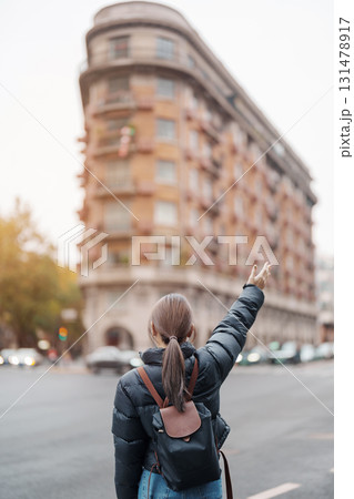 woman traveler visiting in Shanghai, China. Female Tourist with backpack sightseeing Wukang Mansion with Wukang Road and Middle Huaihai Road. landmark and popular for tourism attractions in Shanghai 131478917