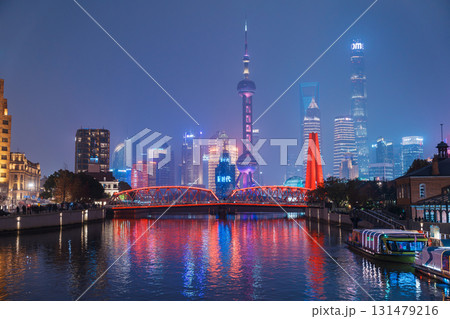 Cityscape view of Shanghai city at night. Skyscraper of Lujiazui in Pudong, view from The Bund of Shanghai, China. landmark and popular for tourism attractions. Travel and Vacation concept Cityscape view of Shanghai city at night. Skyscraper of Lujiazui in Pudong, view from The Bund of Shanghai, China. landmark and popular for tourism attractions. Travel and Vacation concept 131479216