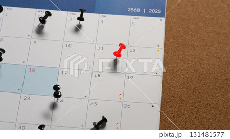 Calendar with a red push pin marking an important date, representing appointment or planning Calendar with a red push pin marking an important date, representing appointment or planning 131481577