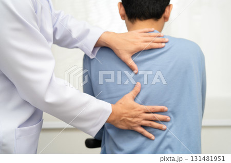 Physical therapy, Asian therapist doctor treat perform pain young man in hospital. 131481951
