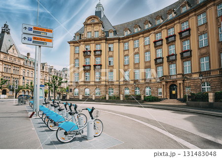 LUXEMBOURG. Row of city bikes for rent on a background of bank building 131483048