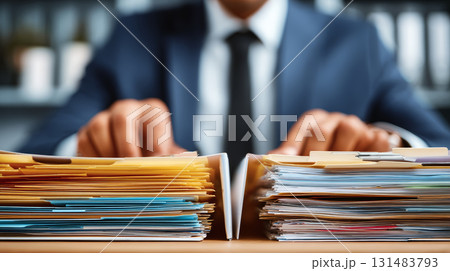 Businessman sorting paperwork, office document organization, professional workspace, focus on hands, productivity, efficiency, stress 131483793