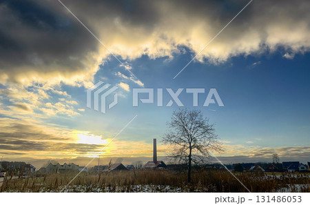 Witness the stunning beauty of a mesmerizing Winter Sunset Over a perfectly serene landscape Witness the stunning beauty of a mesmerizing Winter Sunset Over a perfectly serene landscape 131486053